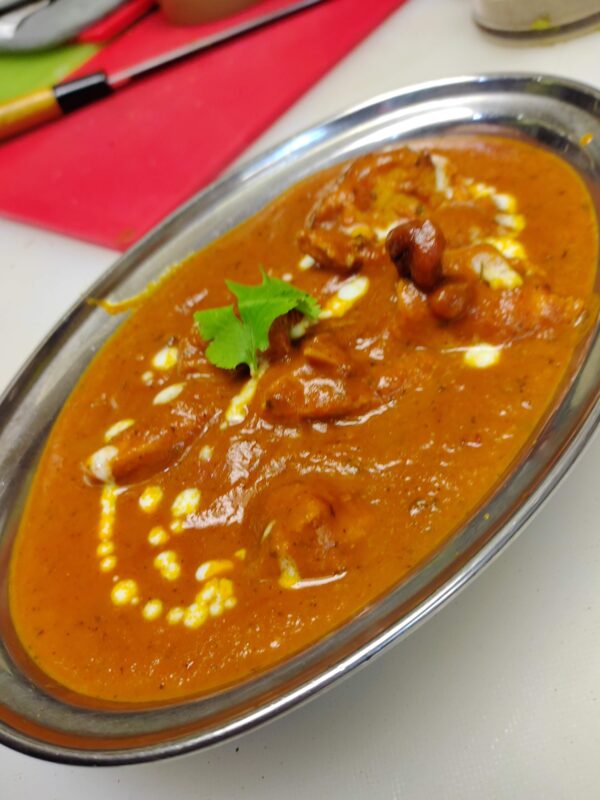 Chicken Curry Halal Bone-in Chicken Meat Marinated in Yogurt, sour cream Spice and then  slow cooked in onion, tomato curry & spices